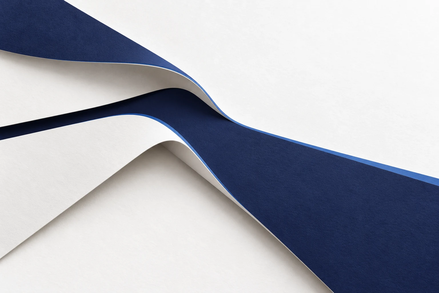Separate paper planes meet and continue as one broad path, representing information made useful.