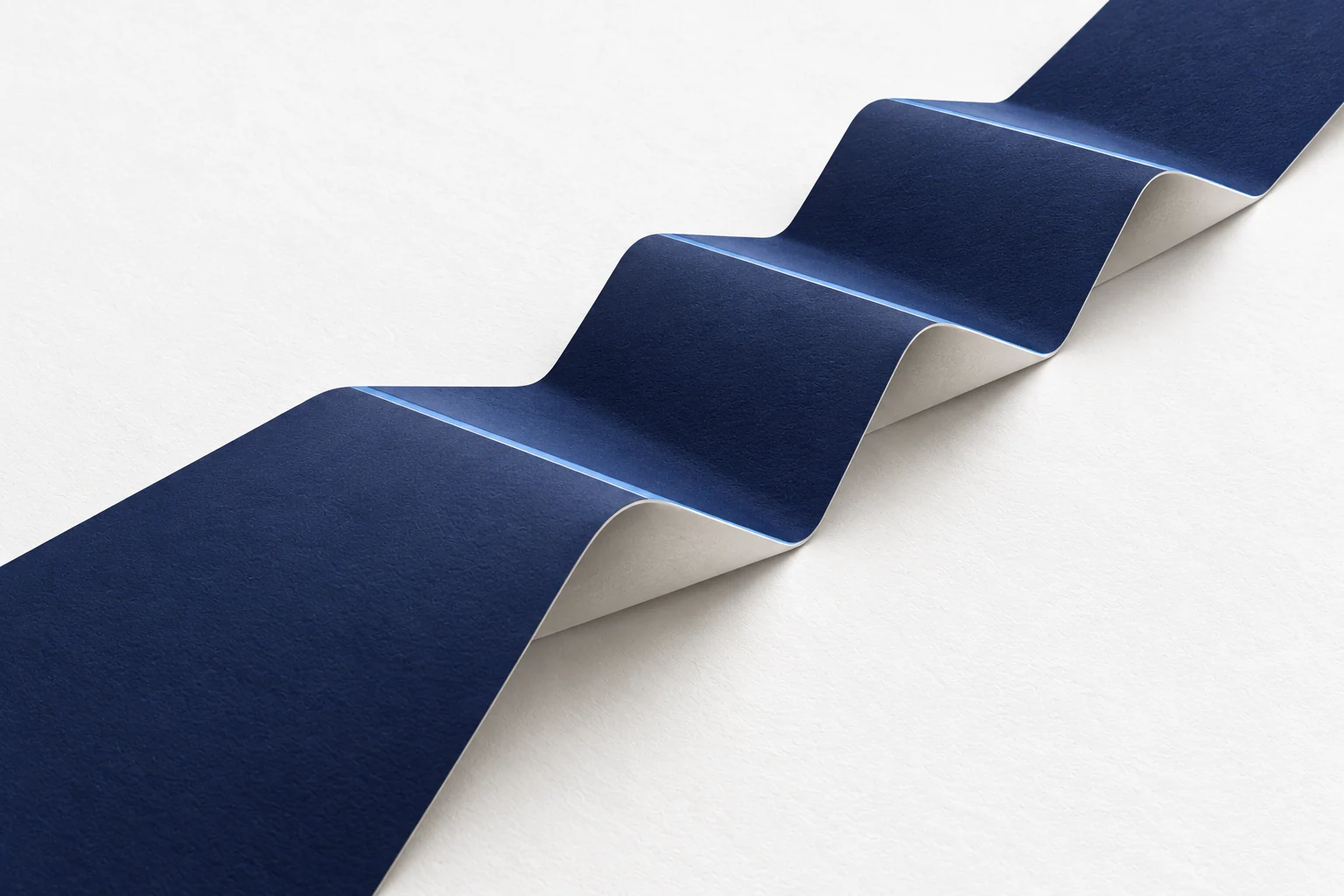 One folded paper path unfolds through four broad stages, illustrating buyer progression.